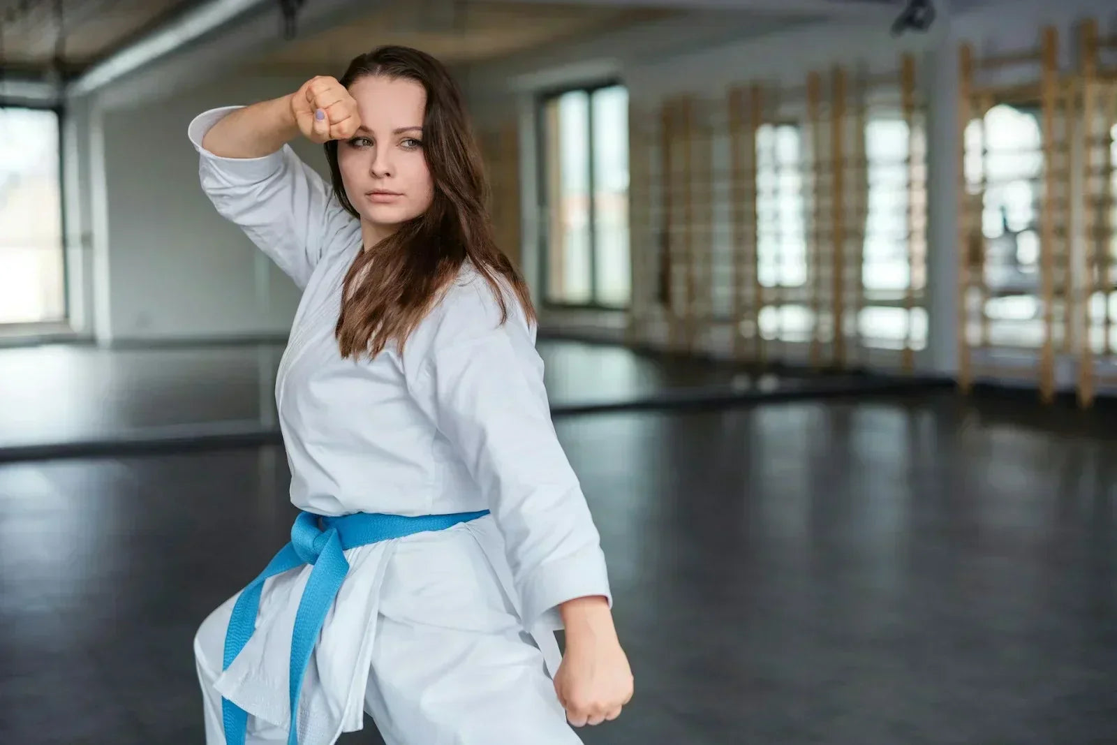 Martial artist practicing stance and balance, demonstrating foot stability and pinkie toe mechanics for athletic performance.